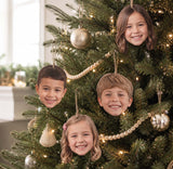 Decorative Christmas tree with personalized face ornaments of a family