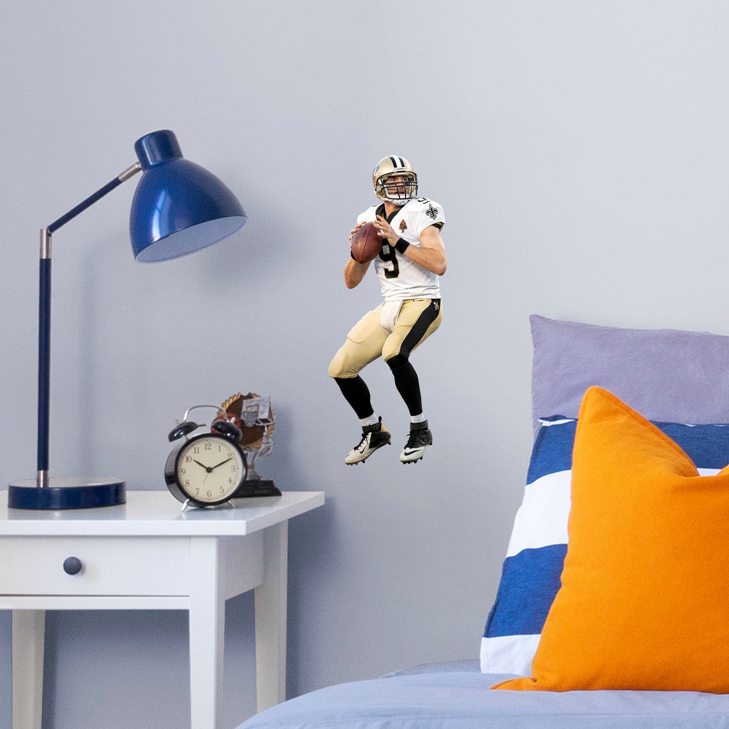 Large Athlete + 1 Decals (7"W x 17"H) Let your favorite Saints quarterback go marching in your man cave, sports bar, or training space with this durable Drew Brees vinyl wall decal. The MVP of Super Bowl XLIV and one of the greatest quarterbacks of all time, Brees is a player you'll be proud to display in your personal Superdome. Should you call an audible and need to relocate, the high-quality decal is easy to remove and display in a new space.