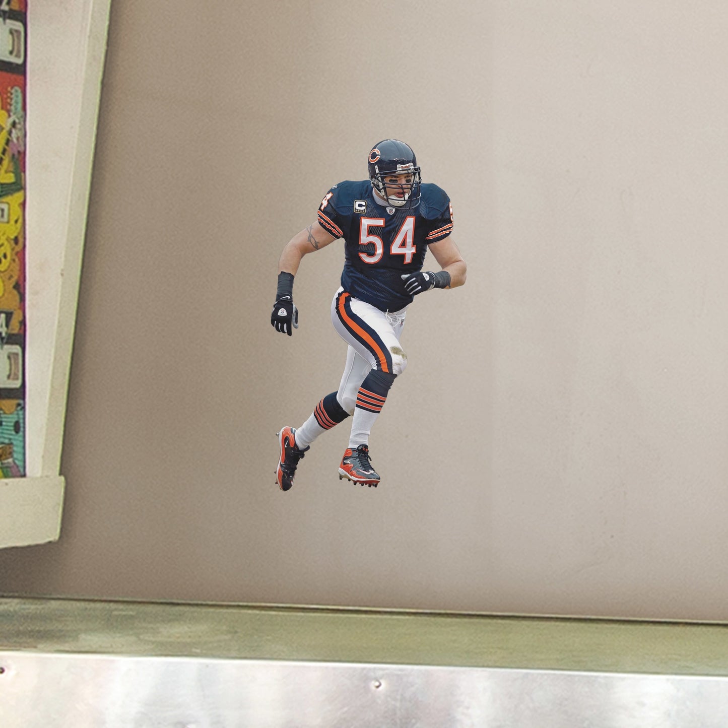 Large Athlete + 2 Decals (9"W x 16.5"H) For 13 years, the Chicago Bears watched #54 earn his place as one of the Top 100 Bears of All time. Rep the navy blue and burnt orange with a high-grade vinyl decal of Da Bears legend Brian Urlacher. Removable, reusable, and tear-resistant, this Hall of Famer is great for bedrooms, man caves, or even as a temporary party decoration. Bear down, Chicago Bears!