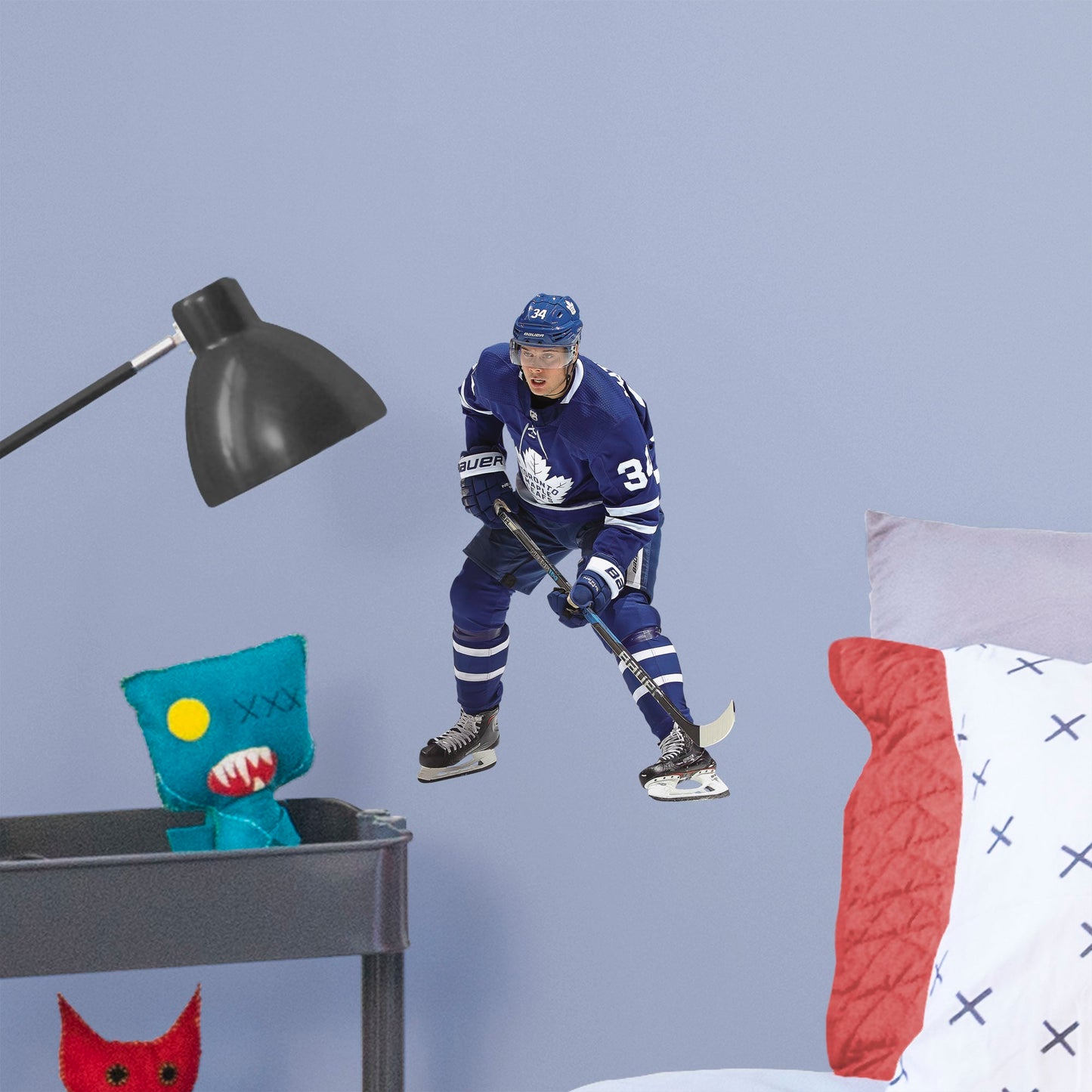 Large Athlete + 2 Decals (10"W x 17"H) He was the first NHL player in modern history to land four goals in his league debut, and now, you can make the Toronto Maple Leafs��� center Auston Matthews part of your bedroom, hallway or game room. Affectionately known as Matty, Austino and Mustache, among other monikers, this durable, tear-resistant NHL wall decal features No. 34 in his navy blue and white Maple Leafs best.