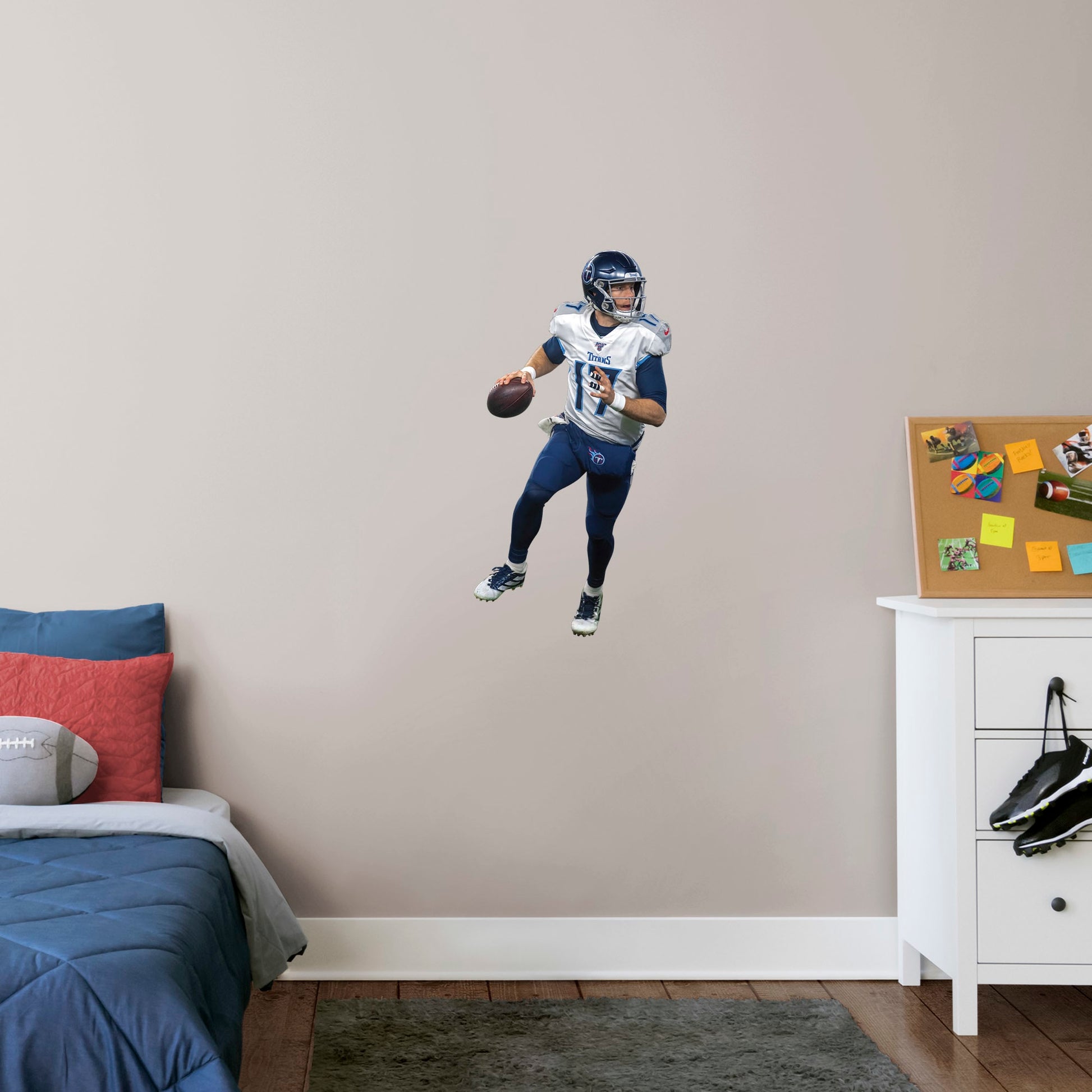X-Large Athlete + 2 Decals (18"W x 38"H) Show off your support for the NFL 2019 Comeback Player of the Year, Ryan Tannehill, with this officially licensed wall decal of the Tennessee Titan quarterback. Considered one of the best quarterbacks in the NFL, Tannessee is geared up to complete the pass and dominate the AFC South in any bedroom, sports bar, or fan cave with this high-quality wall decal in the iconic Titans navy blue and silver uniform. Nashville isn't just for music, Let's go Titans!