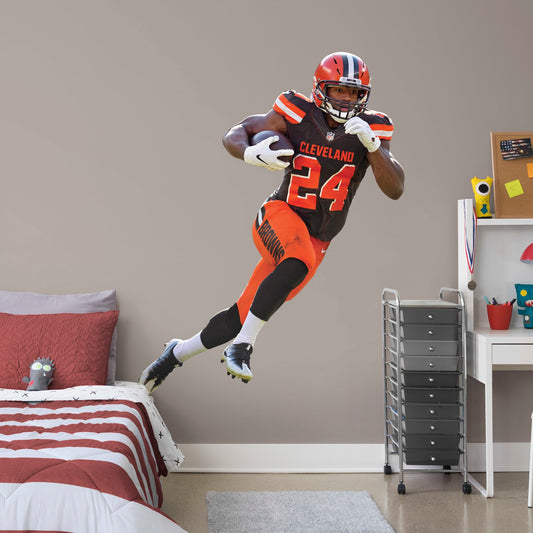 Life-Size Athlete + 2 Decals (57"W x 74"H) Your favorite running back has the ball and is zooming down the field in this dynamic, photo-real wall decal. Celebrate Nick Chubb's brilliant career, from winning SEC Freshman of the Year back at Georgia to his 2019 Pro Bowl appearance with the Browns. This is a high-quality gift for any fan who can't wait to see No. 24 dance through the defenders in his next game.