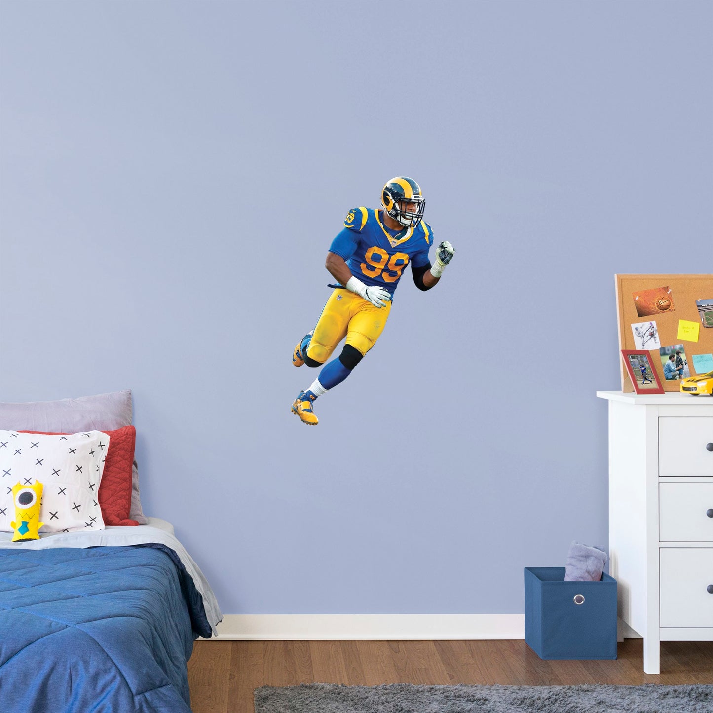 X-Large Athlete + 2 Decals (25"W x 38"H) Ever wish you could meet Aaron Donald, one of the greatest defensive tackles in football history? Show your Los Angeles Rams team spirit with a life-size wall decal of the former Pittsburgh player once recognized as a unanimous All-American draft pick. Officially licensed by the NFL, this removable, high-quality Aaron Donald Throwback Jersey decal will show your Rams pride like no poster can.