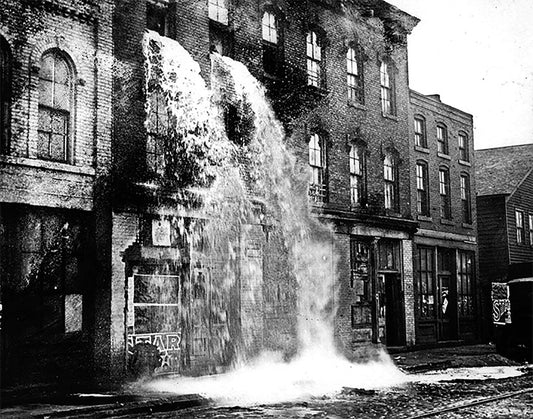 Booze pours out during a raid on a still during Prohibition - Officially Licensed Detroit News Canvas