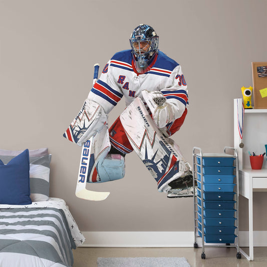 Life-Size Athlete + 2 Decals (51"W x 65"H) Nothing gets past The King! Celebrate the impressive goaltending career of Henrik Lundqvist with this sturdy removable wall decal set depicting him poised to stop that puck. The gold-medal-winning hockey player looks great on any office or bedroom wall, and, unlike this goalie, the decal can be repositioned over time. It's also a great gift for anyone who appreciates Lundqvist's unique approach to tending goal!