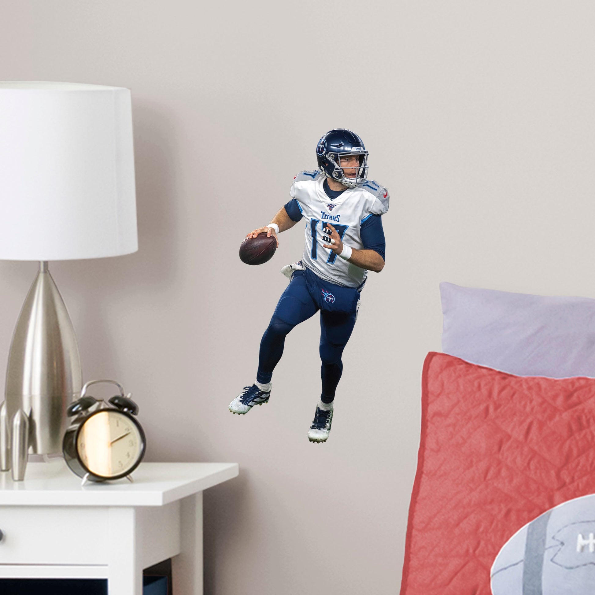 Large Athlete + 2 Decals (8"W x 16.5"H) Show off your support for the NFL 2019 Comeback Player of the Year, Ryan Tannehill, with this officially licensed wall decal of the Tennessee Titan quarterback. Considered one of the best quarterbacks in the NFL, Tannessee is geared up to complete the pass and dominate the AFC South in any bedroom, sports bar, or fan cave with this high-quality wall decal in the iconic Titans navy blue and silver uniform. Nashville isn't just for music, Let's go Titans!