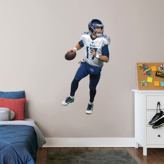 Giant Athlete + 2 Decals (26"W x 51"H) Show off your support for the NFL 2019 Comeback Player of the Year, Ryan Tannehill, with this officially licensed wall decal of the Tennessee Titan quarterback. Considered one of the best quarterbacks in the NFL, Tannessee is geared up to complete the pass and dominate the AFC South in any bedroom, sports bar, or fan cave with this high-quality wall decal in the iconic Titans navy blue and silver uniform. Nashville isn't just for music, let���s go Titans!