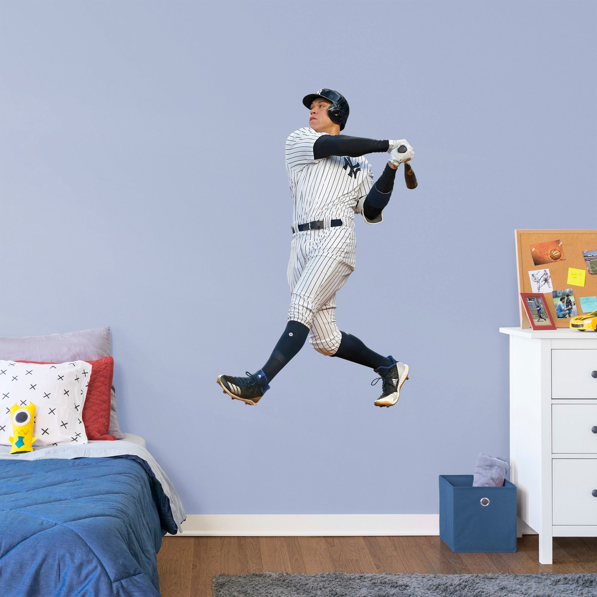 Large Athlete + 2 Decals (11"W x 17"H) Hit a home run with Bleacher Creatures and other fans of the Yankees' navy and white pinstripes with this officially licensed MBL wall decal featuring outfielder Aaron Judge. Easy to apply and remove, this high-quality decal displays the full frame of the former Fresno State Bulldog and the American League's 2017 Rookie of the Year.