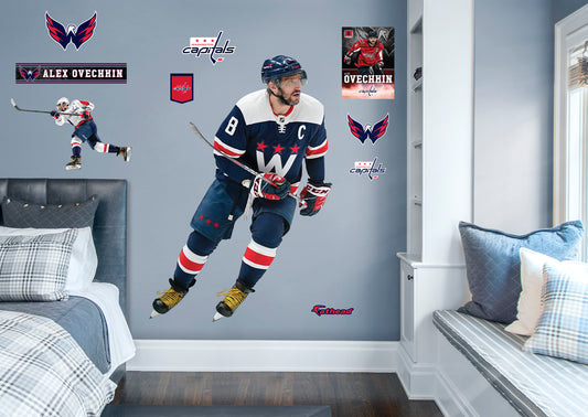 Life-Size Athlete + 9 Decals NHL fans and Capitals fanatics alike love Alex Ovechkin, the clutch captain from Washington D.C., and now you can bring his skill to life in your own home! Seen here in action on the ice in the striking blue uniform, this durable, bold, and removable wall decal set will make the perfect addition to your bedroom, office, fan room, or any spot in your house! Let's Go Caps!