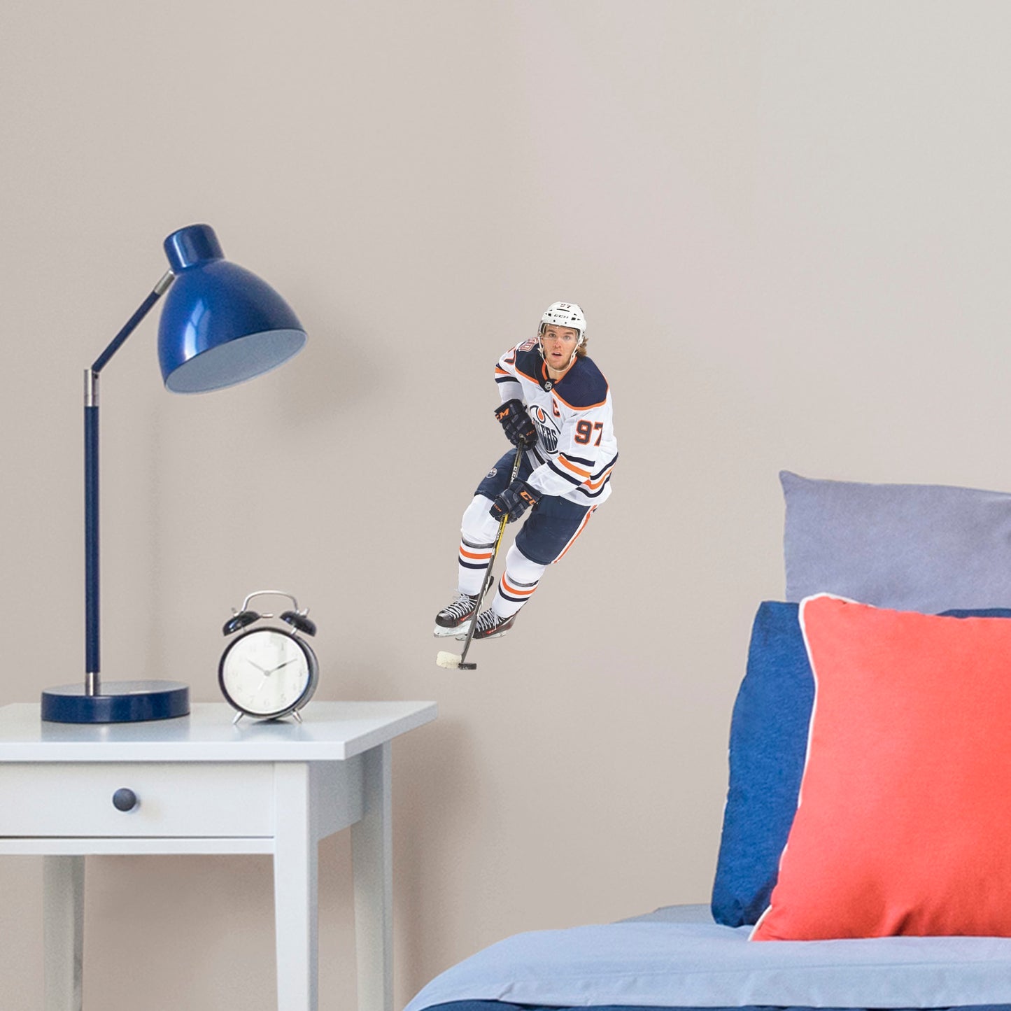 Large Athlete + 2 Team Decals (8"W x 17"H) Widely considered to be among the best NHL players in the world, Edmonton Oilers centre and team captain Connor McDavid has cemented himself as a high-caliber player for the Oilers. Affectionately referred to as "Connor McSaviour" and the "Canadian Super Promise," this officially licensed NHL wall decal depicts the full frame of the Edmonton Oiler's 2015 first overall draft pick in his Away uniform.