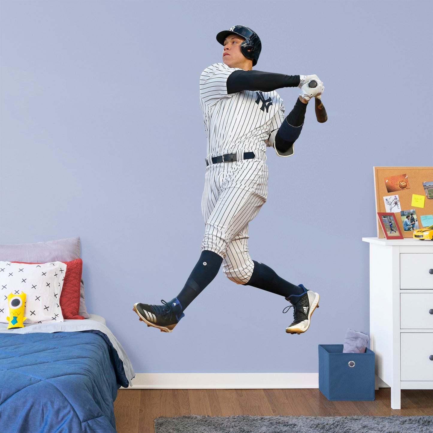 Life-Size Athlete + 12 Decals (49"W x 78"H) Hit a home run with Bleacher Creatures and other fans of the Yankees' navy and white pinstripes with this officially licensed MBL wall decal featuring outfielder Aaron Judge. Easy to apply and remove, this high-quality decal displays the full frame of the former Fresno State Bulldog and the American League's 2017 Rookie of the Year.