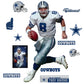 Life-Size Athlete + 11 Decals Quarterback with the Dallas Cowboys for 12 consecutive seasons and inducted in the Pro Football Hall of Fame in 2006, the IceMan can now be memorialized as one of the greats in your den or bedroom with this officially licensed NFL Troy Aikman: Legend removeable wall decal. Featuring the navy blue, metallic silver, royal blue, and white of America’s Team no flags will be called for this durable decal that ensures Aikman can be making passes for seasons to come.