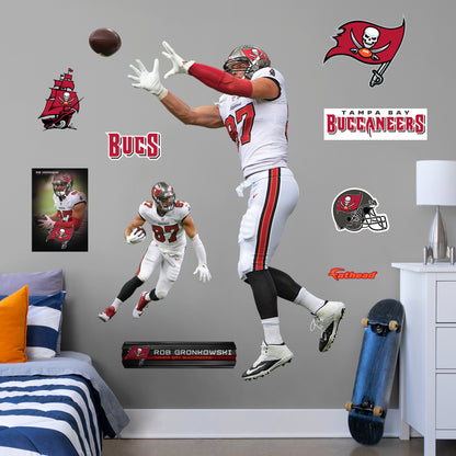 Life-Size Athlete + 10 Decals Bring the action of the NFL into your home with a wall decal of Rob Gronkowski! High quality, durable, and tear resistant, you'll be able to stick and move it as many times as you want to create the ultimate football experience in any room!