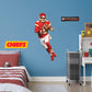 Giant Athlete + 2 Decals (25"W x 49"H) Bring the action of the NFL into your home with a wall decal of Patrick Mahomes! High quality, durable, and tear resistant, you'll be able to stick and move it as many times as you want to create the ultimate football experience in any room!