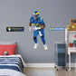 Giant Athlete + 2 Decals (24"W x 51"H) Rams fans know and love Aaron Donald as the star defensive tackle from their favorite team and now they can bring home that Los Angeles pride with an Aaron Donald Removable Wall Decal Set! This wall decal is vibrant and durable so you'll be able to stick it and move it over and over again. Go Rams!