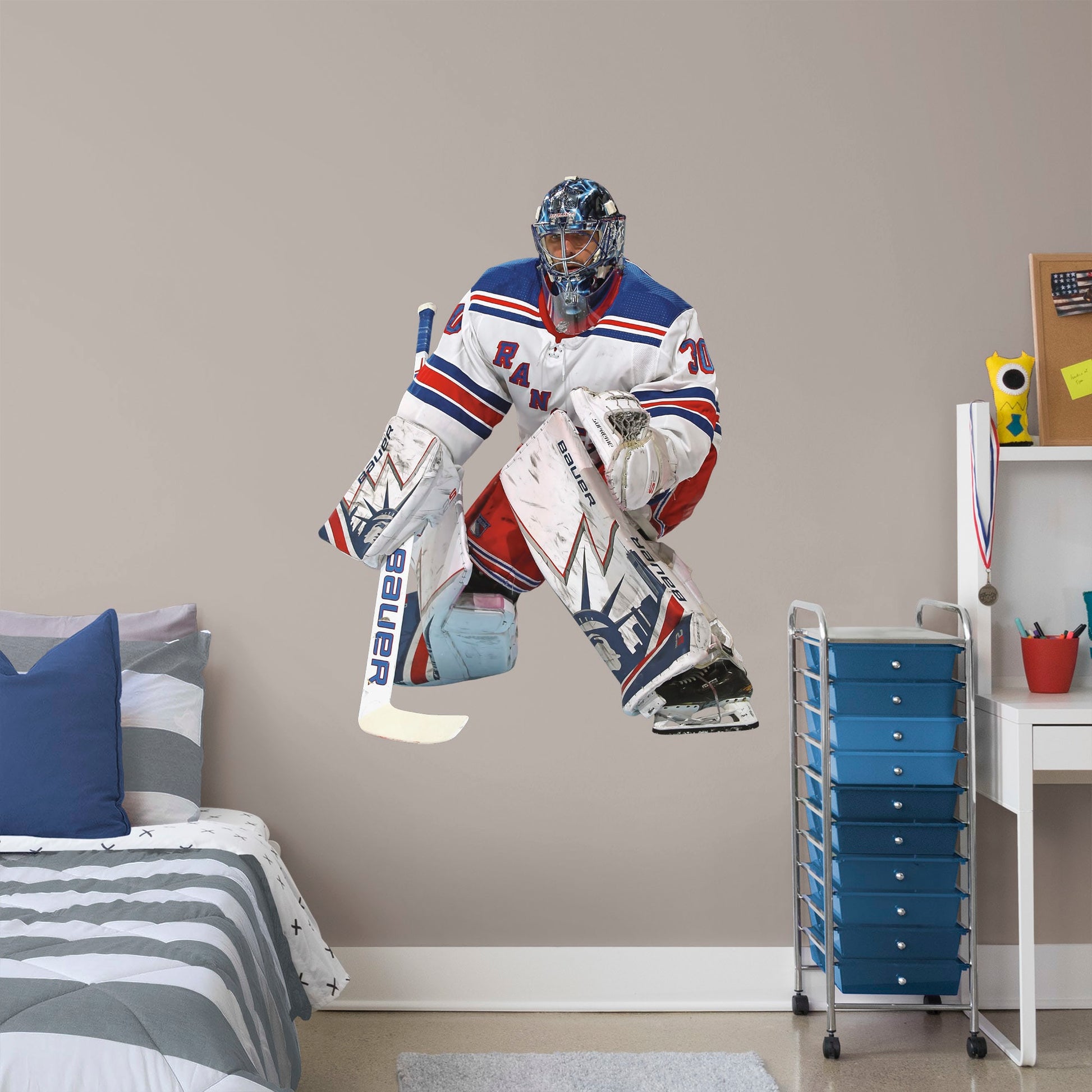 Giant Athlete + 2 Decals (38"W x 50"H) Nothing gets past The King! Celebrate the impressive goaltending career of Henrik Lundqvist with this sturdy removable wall decal set depicting him poised to stop that puck. The gold-medal-winning hockey player looks great on any office or bedroom wall, and, unlike this goalie, the decal can be repositioned over time. It's also a great gift for anyone who appreciates Lundqvist's unique approach to tending goal!
