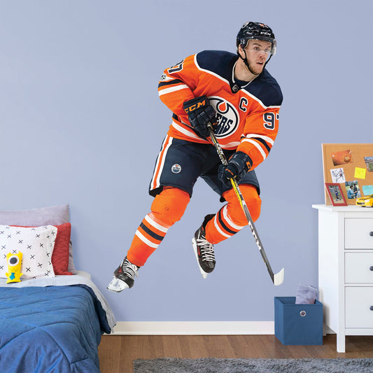 Life-Size Athlete + 2 Decals (49"W x 76"H) Prep to rep team captain McDavid and the Edmonton Oilers to another championship with this quality reusable logo collection. Nicknamed "McJesus" for his skill, this 1st overall 2015 NHL draft pick has scored many awards including the Hart Memorial Trophy. You'll be singing, "Oh, Canada," along with the team at Rogers Place when you post this durable logo in the home, office, or man-cave. O, Canada, we stand on guard for thee (and Connor McDavid!).