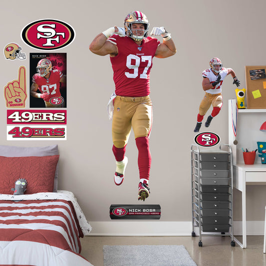 Life-Size Athlete + 10 Decals (36"W x 78"H) Get personally flexed on by Nick Bosa with this unique officially licensed NFL wall decal! The 2019 Defensive Rookie of the Year likely has plenty of tackles ahead of him, and you can celebrate every one for years to come thanks to this high-quality graphic. The reusable design lets you move the Pro Bowl player wherever you choose, so you can celebrate in your bedroom, dorm room, or living room.