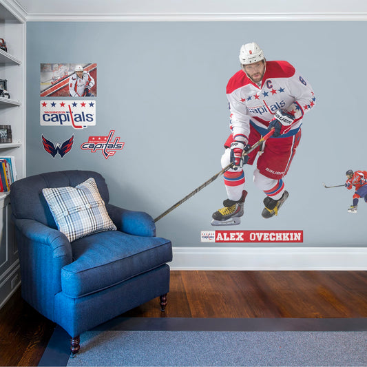 Athlete Only (72"W x 72"H) NHL fans and Capitals fanatics alike love Alex Ovechkin, the clutch captain from Washington D.C., and now you can bring his skill to life in your own home! Seen here in his away uniform in action on the ice, this durable, bold, and removable wall decal will make the perfect addition to your bedroom, office, fan room, or any spot in your house! Let's Go Caps!