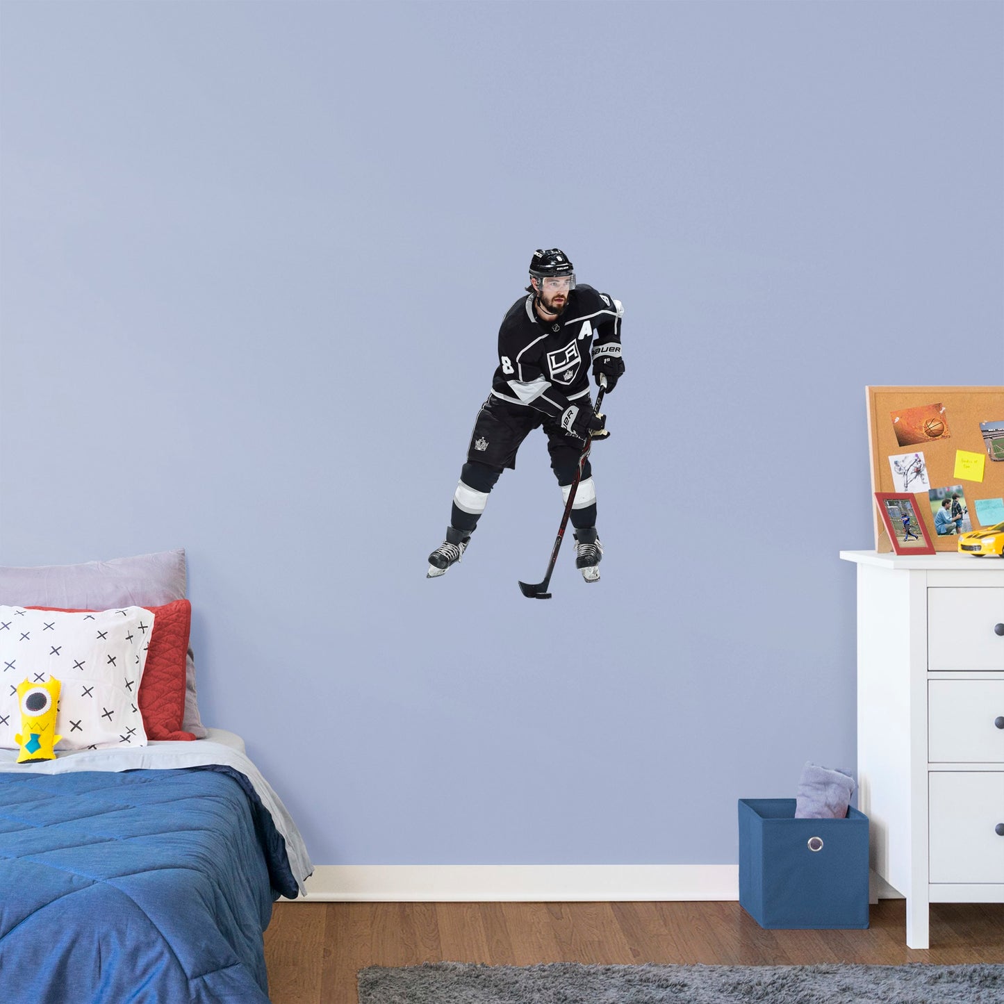 X-Large Athlete + 2 Decals (22"W x 38"H) Drew Doughty has been a star from the very start and now Los Angeles Kings fanatics can bring him to life in your own home with this Officially Licensed NHL Removable Wall Decal. Shown here in action in the Kings home uniform, this wall decal is durable and high quality and is sure to bring the action to your bedroom, office, or fan room. 