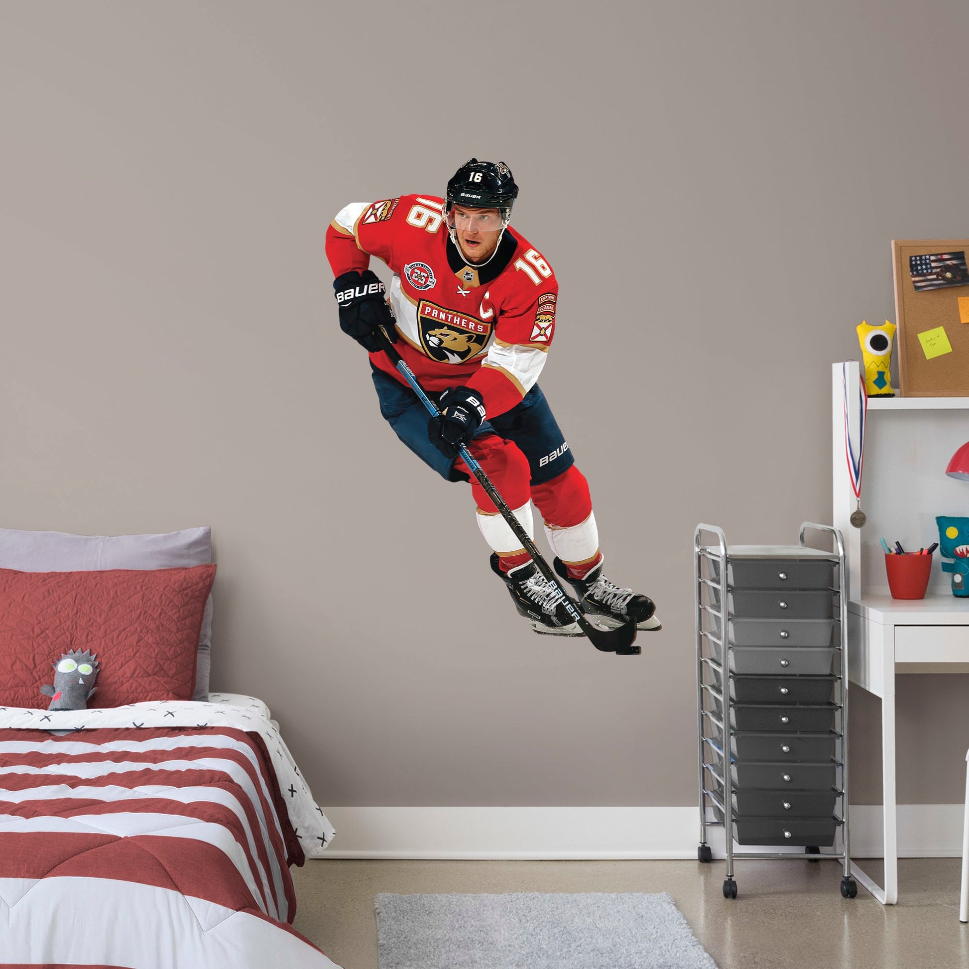 X-Large Athlete + 2 Team Decals (25"W x 37"H) NHL fans and Panthers fanatics alike love Aleksander Barkov, the clutch captain from Florida, and now you can bring his skill to life in your own home! Seen here in action on the ice, this durable and bold wall decal will make the perfect addition to your bedroom, office, fan room, or any spot in your house! 