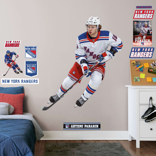 Life-Size Athlete + 2 Decals (62"W x 71"H) The opposing goaltender had better be in position when Artemi Panarin takes the ice in this officially licensed NHL wall decal. The left wing for the New York Rangers has been making noise throughout the league since going undrafted and then becoming one of the NHL's top rookies a few years ago. This high-quality decal of the Breadman is the perfect addition to any Rangers fan's game room or bar, and can be easily removed in case it needs to be regifted.