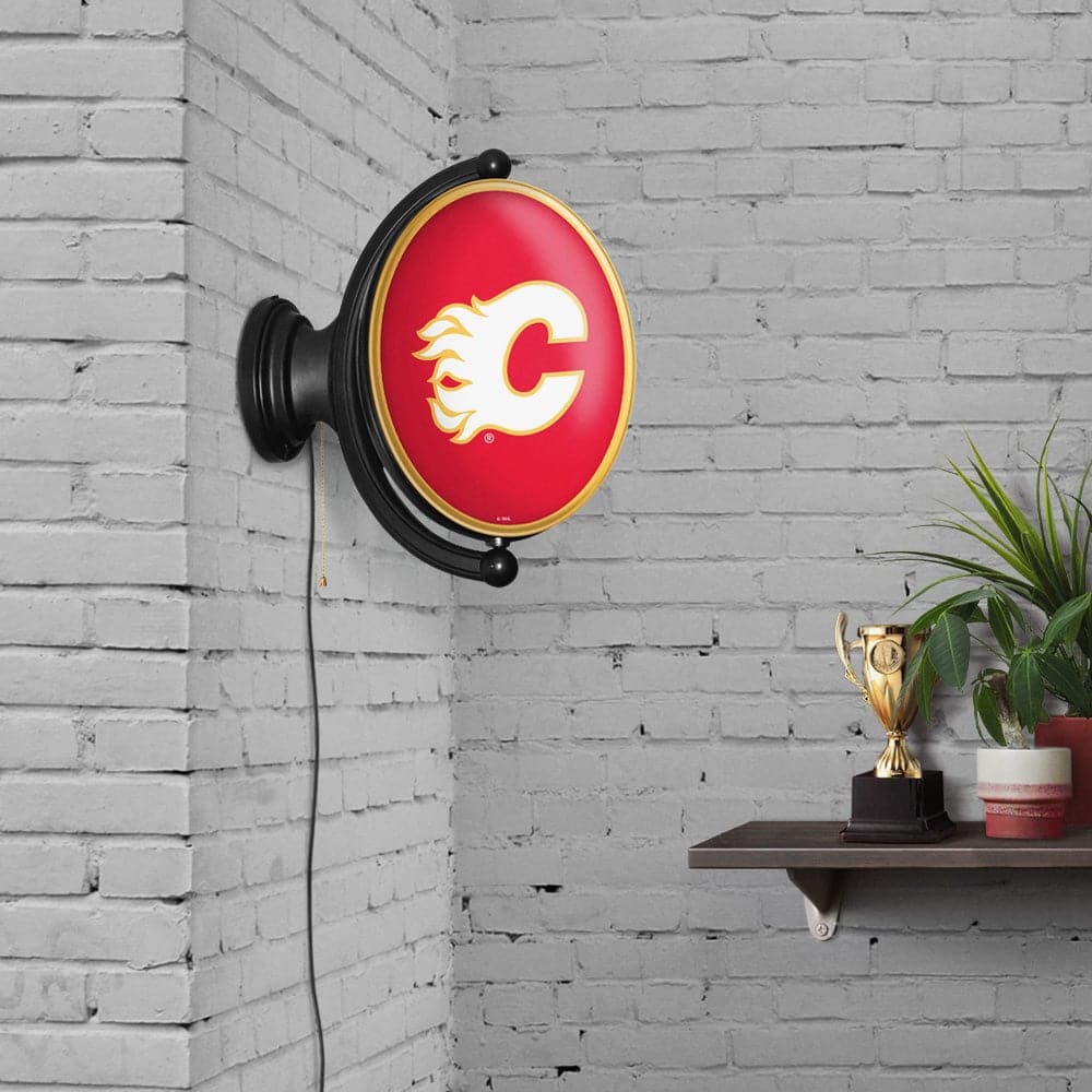 Calgary Flames: Original Oval Rotating Lighted Wall Sign - The Fan-Brand