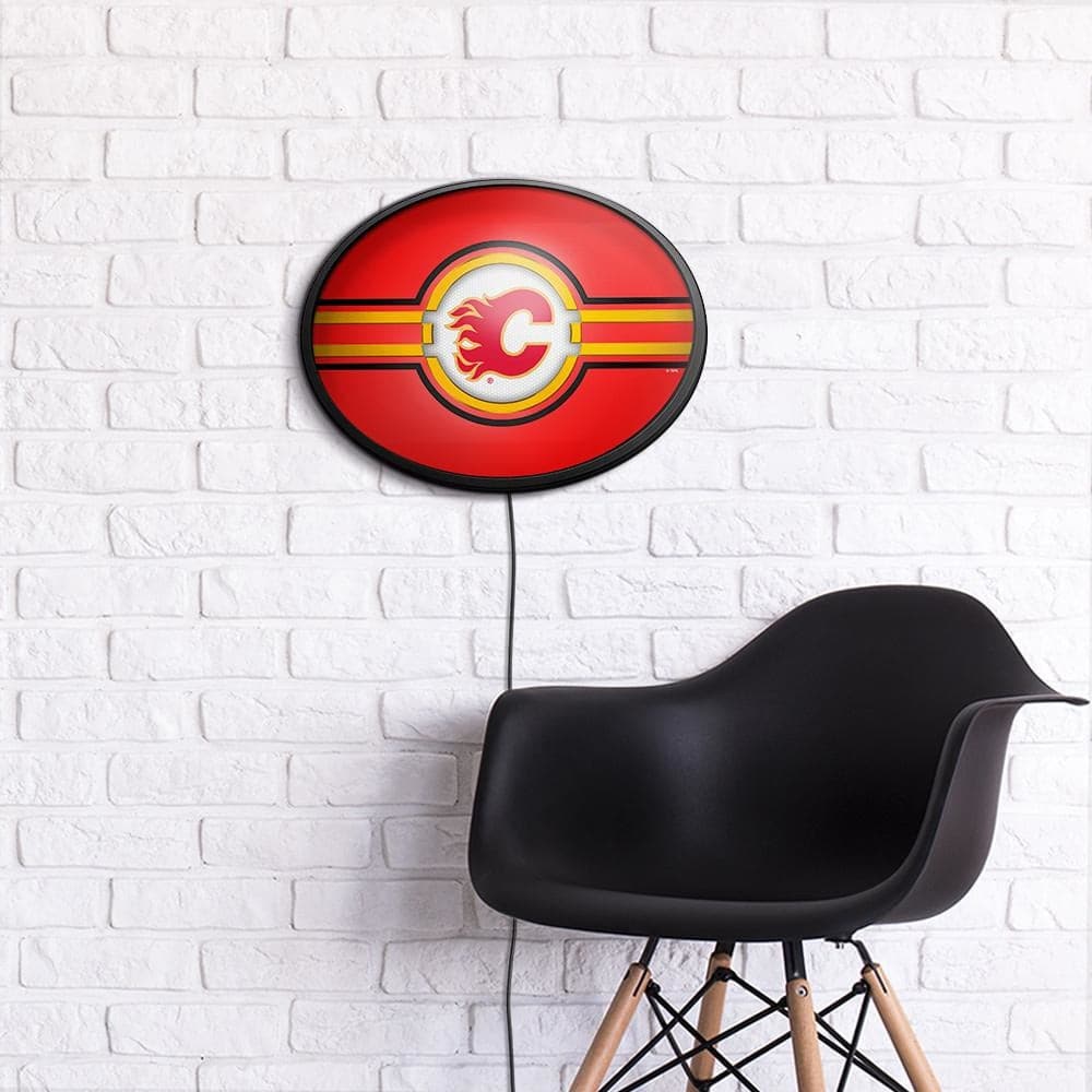 Calgary Flames: Oval Slimline Lighted Wall Sign - The Fan-Brand