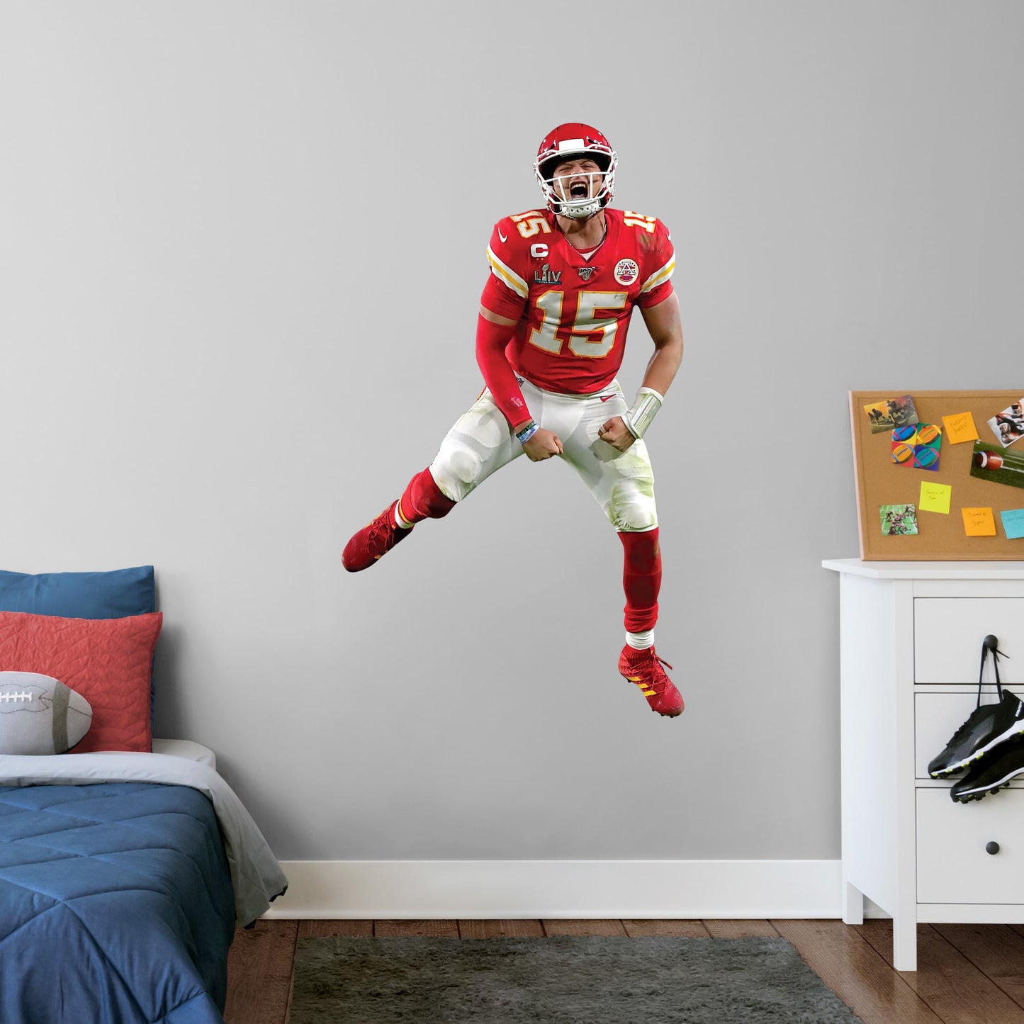 Giant Athlete + 2 Decals (29"W x 51"H) Celebrate the Chiefs' epic Super Bowl LIV win over the 49ers with this high-quality, repositionable decal of MVP quarterback Patrick Mahomes celebrating the victory. Featuring plenty of the Chiefs' red and gold, this enthusiastic Magic Mahomes decal will brighten every day of your week. It's perfect for dorms, bedrooms, and sports bars because this durable, reusable Mahomes decal only damages the competition, not your walls.