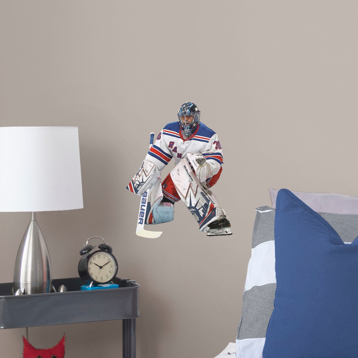 Large Athlete + 2 Decals (12"W x 15"H) Nothing gets past The King! Celebrate the impressive goaltending career of Henrik Lundqvist with this sturdy removable wall decal set depicting him poised to stop that puck. The gold-medal-winning hockey player looks great on any office or bedroom wall, and, unlike this goalie, the decal can be repositioned over time. It's also a great gift for anyone who appreciates Lundqvist's unique approach to tending goal!