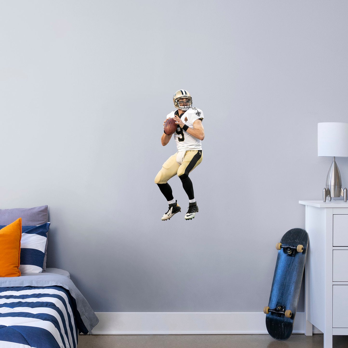 X-Large Athlete + 1 Decal (15"W x 39"H) Let your favorite Saints quarterback go marching in your man cave, sports bar, or training space with this durable Drew Brees vinyl wall decal. The MVP of Super Bowl XLIV and one of the greatest quarterbacks of all time, Brees is a player you'll be proud to display in your personal Superdome. Should you call an audible and need to relocate, the high-quality decal is easy to remove and display in a new space.