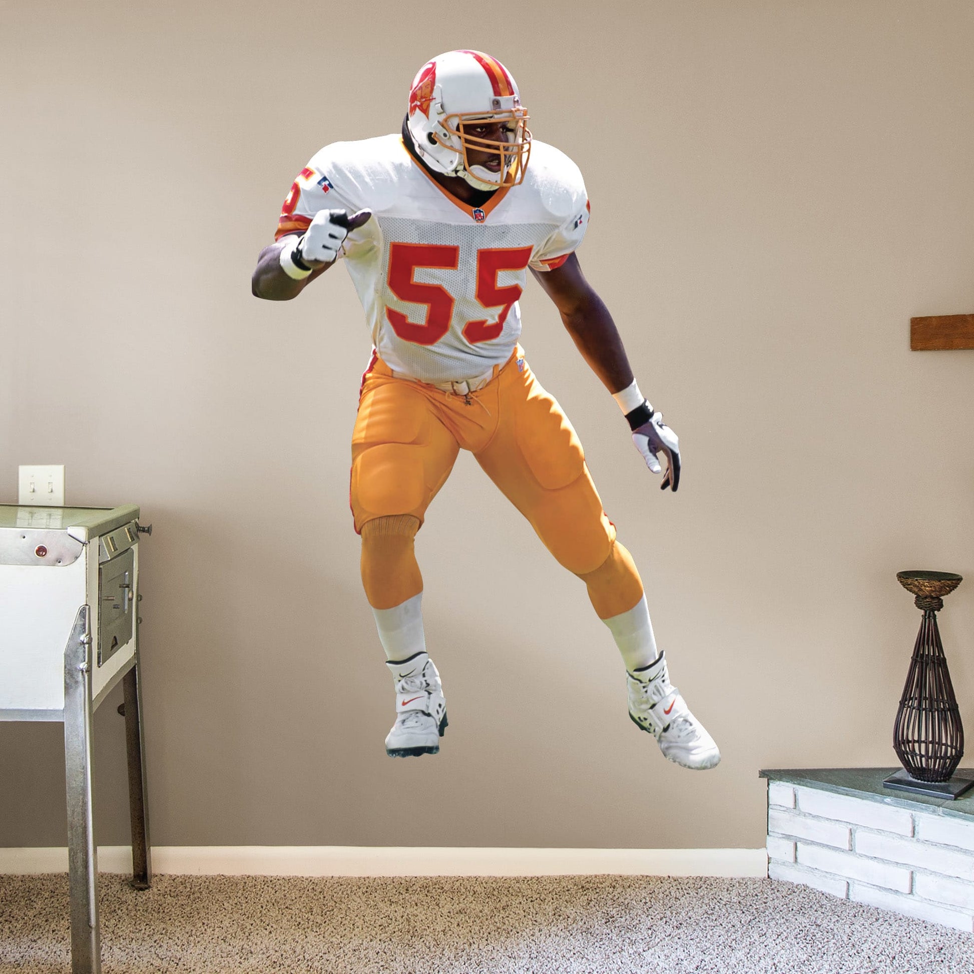 Life-Size Athlete + 2 Decals (51"W x 78"H) Immortalize The Sheriff's amazing career on your wall with this officially licensed decal. Derrick Brooks' amazing accolades range from Super Bowl champion to his 11 Pro Bowl appearances, and he has rightfully taken his place in the Pro Football Hall of Fame. This high-quality decal makes a great gift, and it can be removed and reaffixed to walls as you decide on the best place to show off your Bucs pride for this legend's impressive impact on the sport.