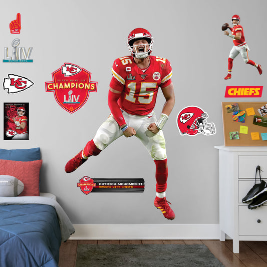Life-Size Athlete + 11 Decals (45"W x 78"H) Celebrate the Chiefs' epic Super Bowl LIV win over the 49ers with this high-quality, repositionable decal of MVP quarterback Patrick Mahomes celebrating the victory. Featuring plenty of the Chiefs' red and gold, this enthusiastic Magic Mahomes decal will brighten every day of your week. It's perfect for dorms, bedrooms, and sports bars because this durable, reusable Mahomes decal only damages the competition, not your walls.