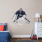 Giant Athlete + 2 Decals (45"W x 38"H) Opposing teams should be worried when they see Connor Hellebuyck in the goal, and now you can bring his epic defense skills to life in your own home with this Officially Licensed NHL removable wall decal. Pictured here ready to stop any puck that comes his way, this wall decal of Hellebuyck will make the perfect addition to your bedroom, office, or fan room, and it even makes a great gift for your favorite Jets fanatic!