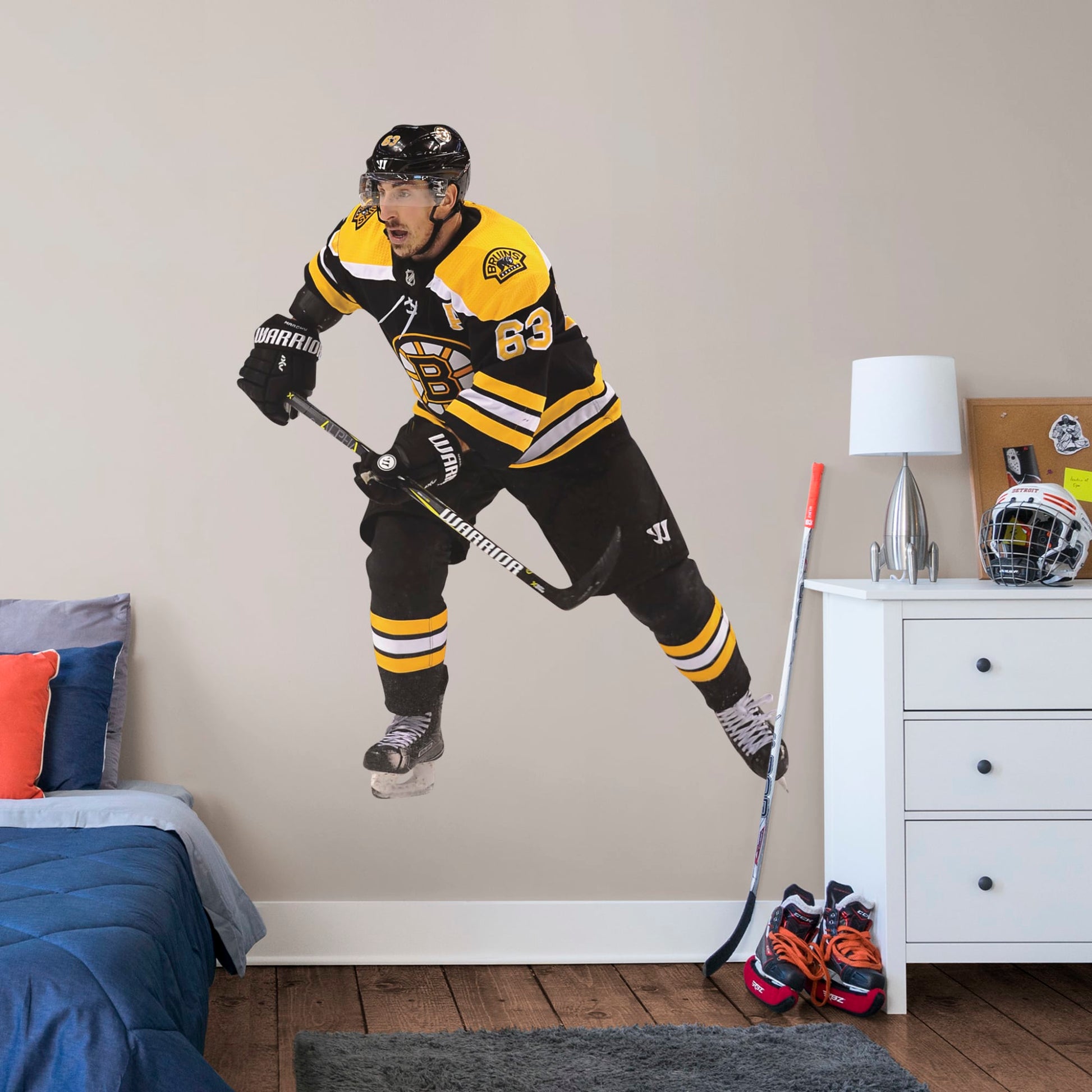 Giant Athlete + 2 Decals (38"W x 46"H) Bruins fans know that the opposing team should be scared when Brad Marchand hits the ice, and now you can bring that action to life in your own home with this Officially Licensed NHL Removable Wall Decal! Seen here in the Boston home uniform, this removable and reusable decal of Marchand is bold and durable, making it the perfect addition to your bedroom, office, or fan room. Go Bruins!