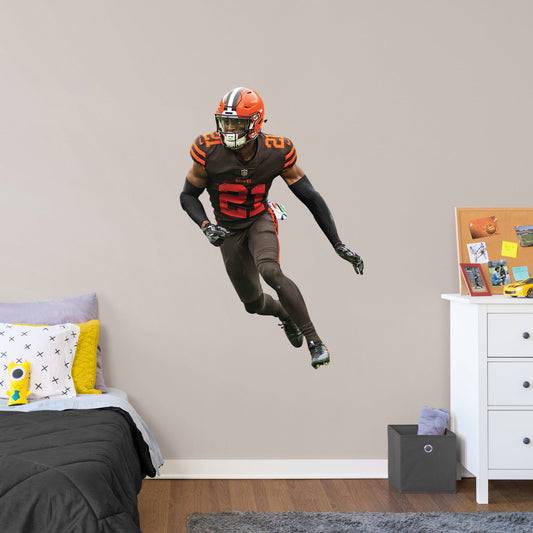 Giant Athlete + 2 Decals (33"W x 51"H) Bring the action of the NFL into your home with a wall decal of Denzel Ward! High quality, durable, and tear resistant, you'll be able to stick and move it as many times as you want to create the ultimate football experience in any room!
