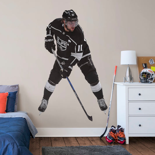 X-Large Athlete + 2 Decals (24"W x 39"H) NHL fans and Kings fanatics alike love Anze Kopitar, the clutch captain from Los Angeles, and now you can bring his skill to life in your own home! Seen here in his home uniform in action on the ice, this durable, bold, and removable wall decal will make the perfect addition to your bedroom, office, fan room, or any spot in your house! Let's Go Kings!