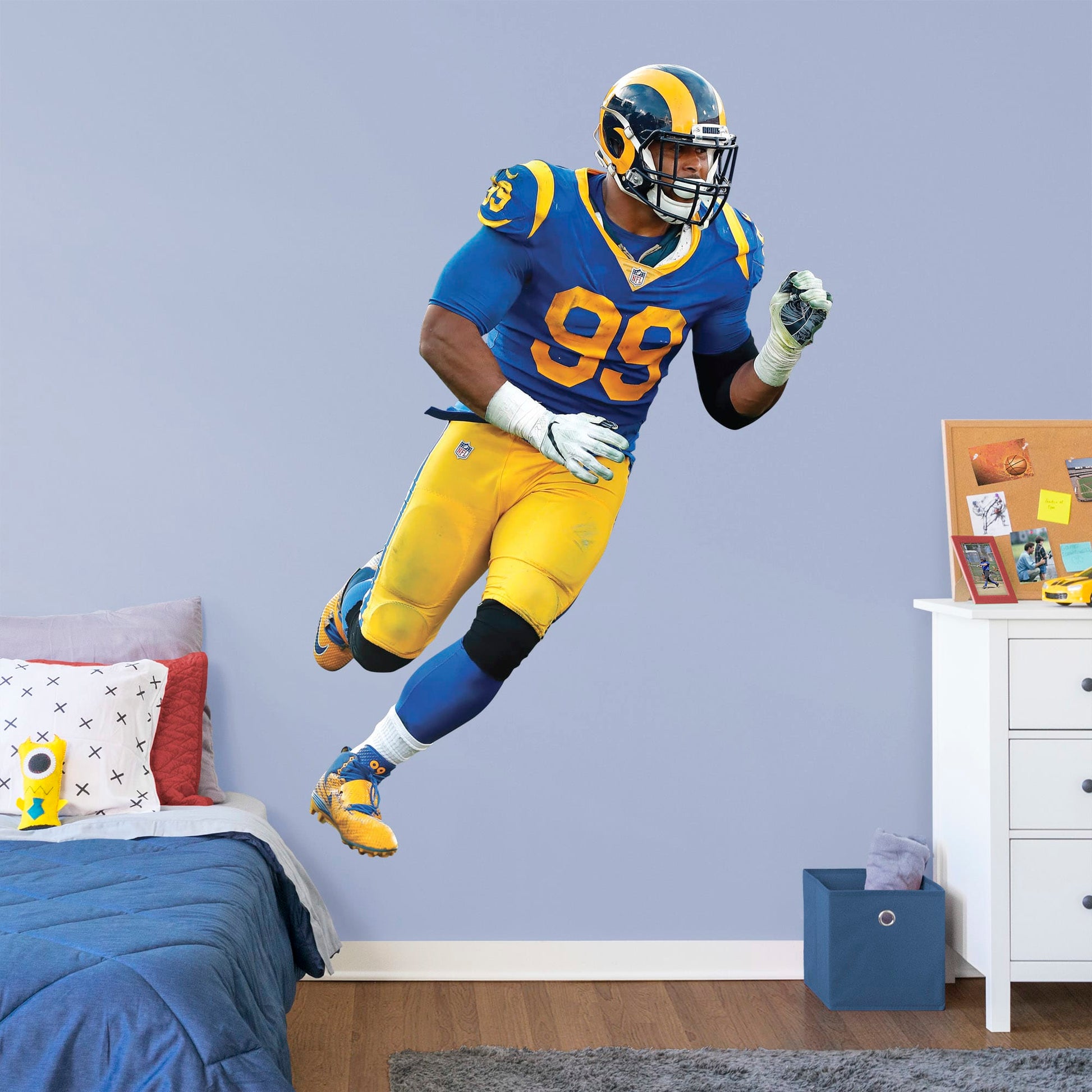 Life-Size Athlete + 2 Decals (44"W x 77"H) Ever wish you could meet Aaron Donald, one of the greatest defensive tackles in football history? Show your Los Angeles Rams team spirit with a life-size wall decal of the former Pittsburgh player once recognized as a unanimous All-American draft pick. Officially licensed by the NFL, this removable, high-quality Aaron Donald Throwback Jersey decal will show your Rams pride like no poster can.