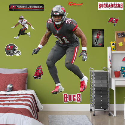 Life-Size Athlete + 9 Decals (49"W x 78"H) Bring the action of the NFL into your home with a wall decal of your favorite player! High quality, durable, and tear resistant, you'll be able to stick and move it as many times as you want to create the ultimate football experience in any room!