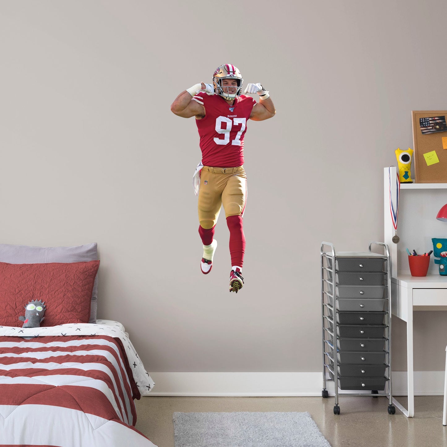 Giant Athlete + 2 Decals (23"W x 51"H) Get personally flexed on by Nick Bosa with this unique officially licensed NFL wall decal! The 2019 Defensive Rookie of the Year likely has plenty of tackles ahead of him, and you can celebrate every one for years to come thanks to this high-quality graphic. The reusable design lets you move the Pro Bowl player wherever you choose, so you can celebrate in your bedroom, dorm room, or living room.