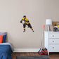 X-Large Athlete + 2 Decals (29"W x 35"H) Bruins fans know that the opposing team should be scared when Brad Marchand hits the ice, and now you can bring that action to life in your own home with this Officially Licensed NHL Removable Wall Decal! Seen here in the Boston home uniform, this removable and reusable decal of Marchand is bold and durable, making it the perfect addition to your bedroom, office, or fan room. Go Bruins!