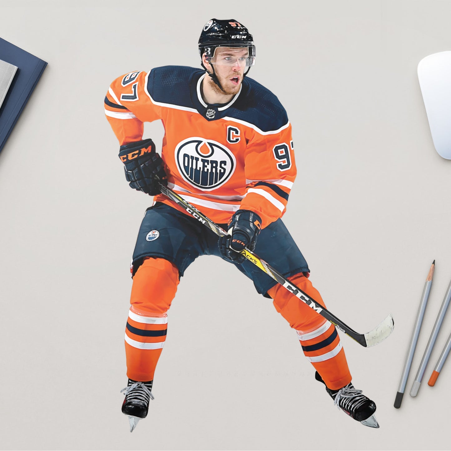 You can't always make it to Rogers Place in person, but now you can bring the action on the ice to life in your own home with this Officially Licensed NHL removable wall decal of the Oilers' very own Connor McDavid! Widely considered to be one of the best players in the league, this decal of the beloved Oilers captain is sure to bring some excitement to your bedroom, office, or fan room.