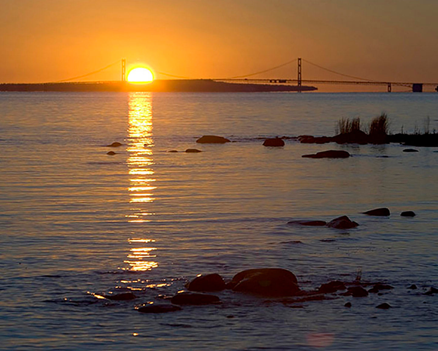Sun rises over the Mackinac Bridge - Officially Licensed Detroit News Puzzle