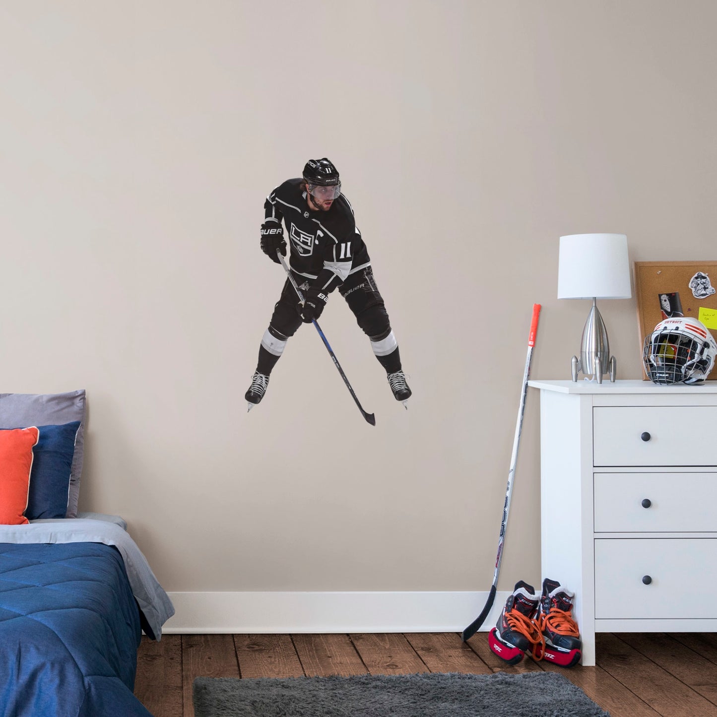 Giant Athlete + 2 Decals (32"W x 51"H) NHL fans and Kings fanatics alike love Anze Kopitar, the clutch captain from Los Angeles, and now you can bring his skill to life in your own home! Seen here in his home uniform in action on the ice, this durable, bold, and removable wall decal will make the perfect addition to your bedroom, office, fan room, or any spot in your house! Let's Go Kings!