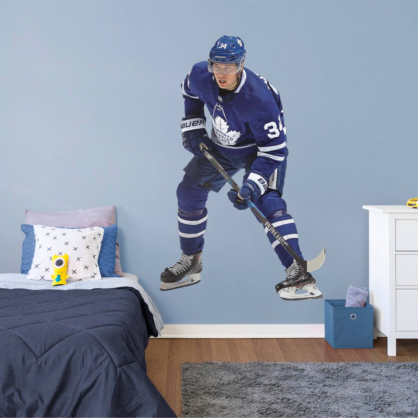 Life-Size Athlete + 2 Decals (48"W x 76"H) He was the first NHL player in modern history to land four goals in his league debut, and now, you can make the Toronto Maple Leafs’ center Auston Matthews part of your bedroom, hallway or game room. Affectionately known as Matty, Austino and Mustache, among other monikers, this durable, tear-resistant NHL wall decal features No. 34 in his navy blue and white Maple Leafs best.