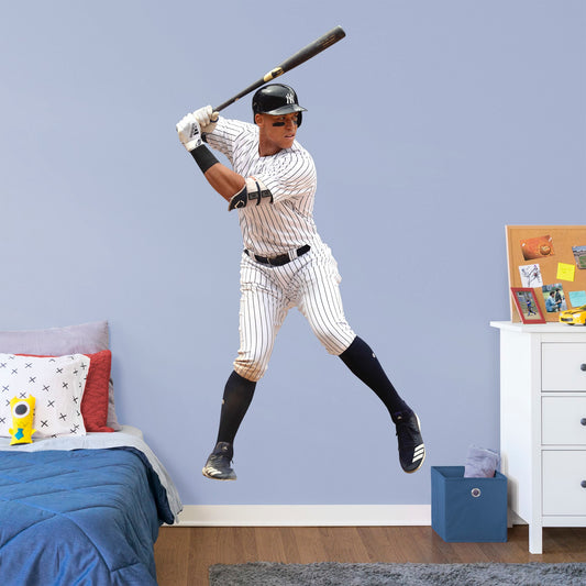 Life-Size Athlete + 13 Decals (49"W x 89"H) Feed your inner sports fanatic with this unique Aaron Judge wall decal. Perfect for unseasoned Yanks or lifelong season-ticket holders, the reusable image of the 2017 Rookie of the Year pick can be moved from room to room with ease. The verdict is in: this adhesive graphic is perfect die-hard fans of The Judge.