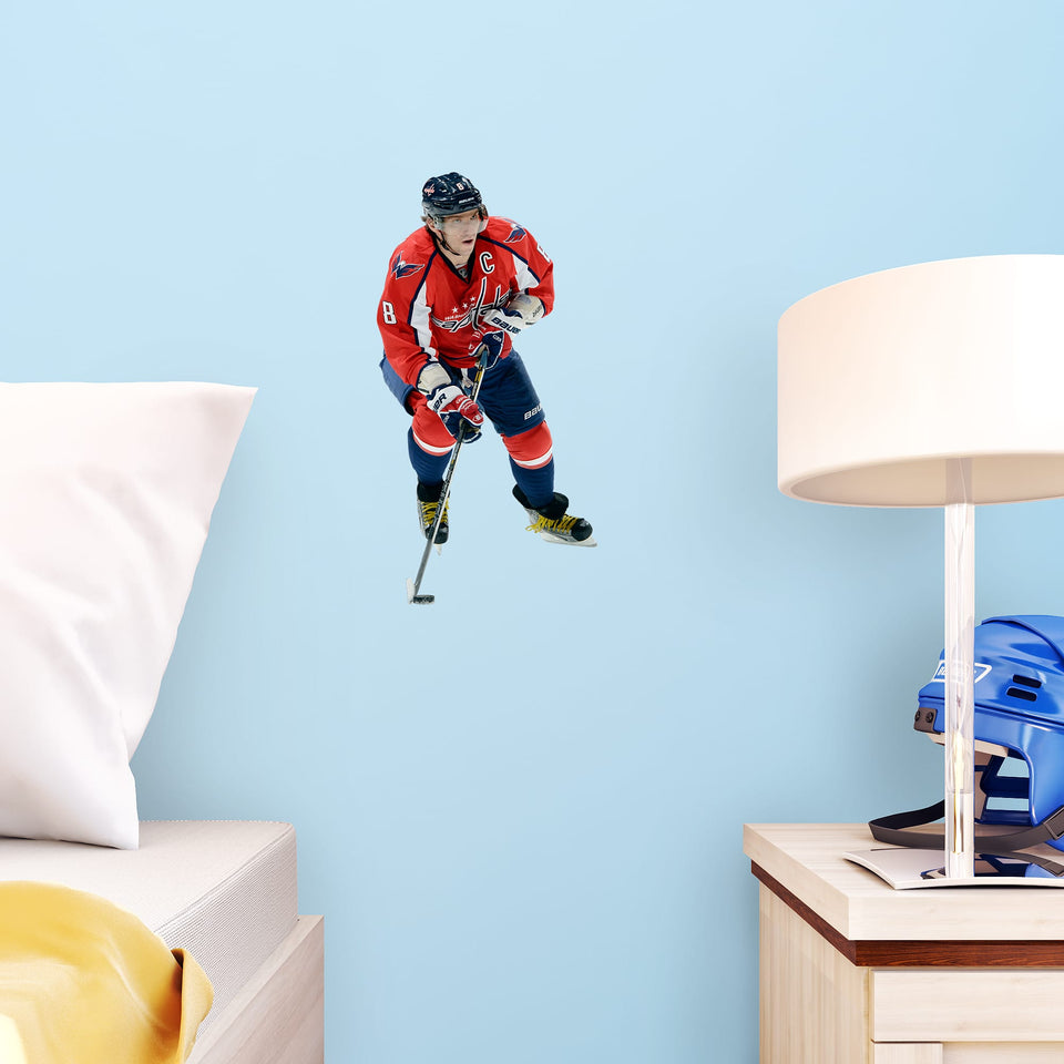 NHL fans and Capitals fanatics alike love Alex Ovechkin, the clutch captain from Washington D.C., and now you can bring his skill to life in your own home! Seen here in action on the ice, this durable and bold removable wall decal will make the perfect addition to your bedroom, office, fan room, or any spot in your house!