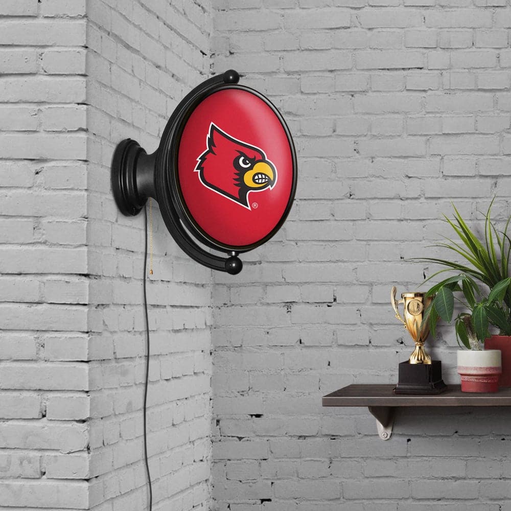 Louisville Cardinals: Original Oval Rotating Lighted Wall Sign - The Fan-Brand