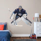 Life-Size Athlete + 2 Decals (55"W x 46"H) Opposing teams should be worried when they see Connor Hellebuyck in the goal, and now you can bring his epic defense skills to life in your own home with this Officially Licensed NHL removable wall decal. Pictured here ready to stop any puck that comes his way, this wall decal of Hellebuyck will make the perfect addition to your bedroom, office, or fan room, and it even makes a great gift for your favorite Jets fanatic!