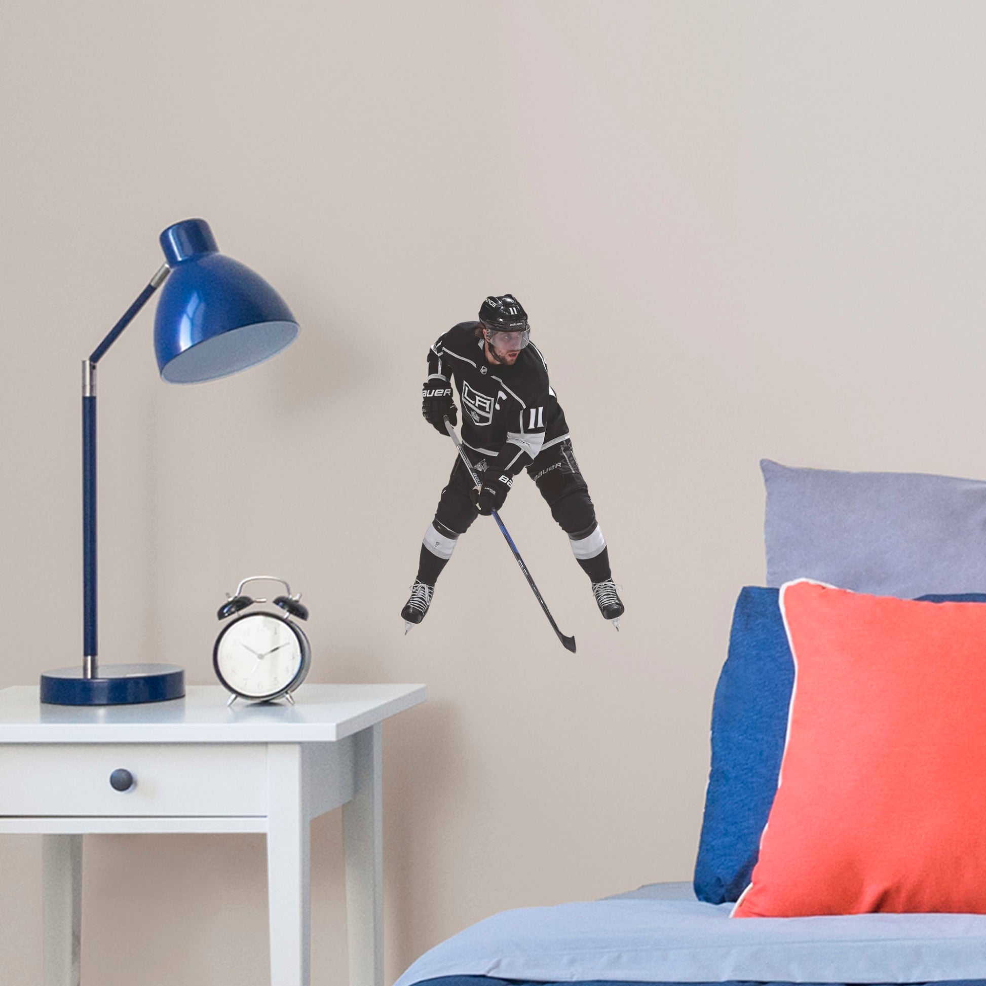 Life-Size Athlete + 12 Decals (46"W x 75"H) NHL fans and Kings fanatics alike love Anze Kopitar, the clutch captain from Los Angeles, and now you can bring his skill to life in your own home! Seen here in his home uniform in action on the ice, this durable, bold, and removable wall decal will make the perfect addition to your bedroom, office, fan room, or any spot in your house! Let's Go Kings!
